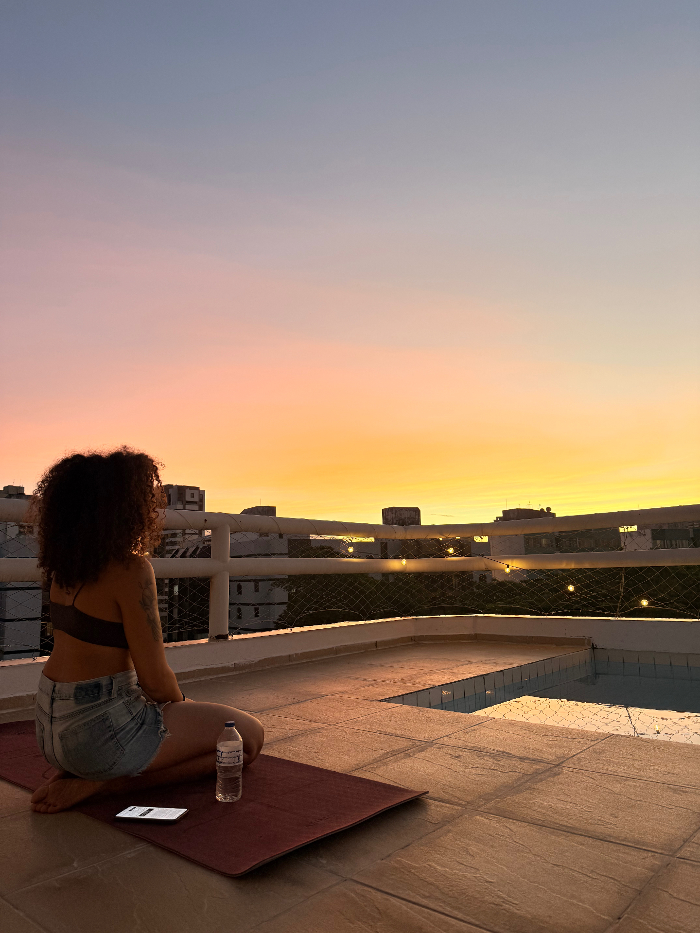 Rooftop sunset over the city skyline